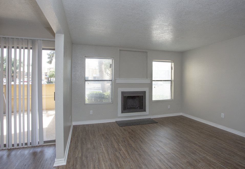 A room with a fireplace and a window.